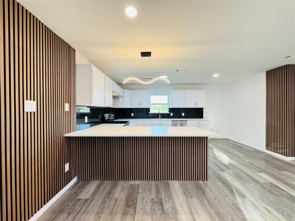 106 Hillcrest Street Mansfield, TX 76063 - Photo 9 of 26 a kitchen with stainless steel appliances granite countertop a sink and cabinets