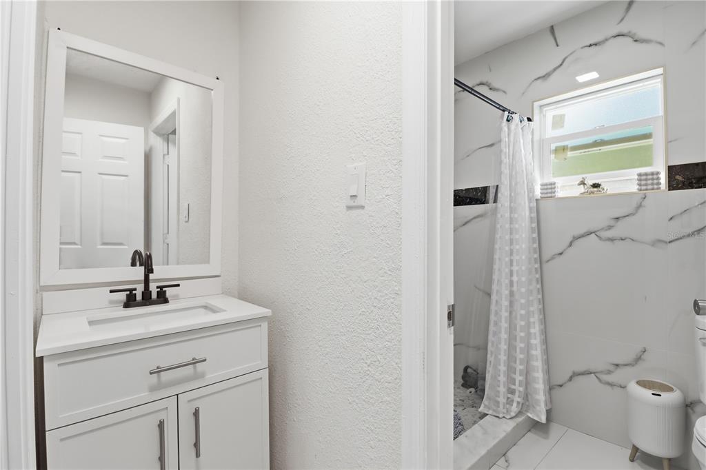 67 Cove Road Inglis, FL 34449 - Photo 12 of 35 a bathroom with a sink toilet and shower
