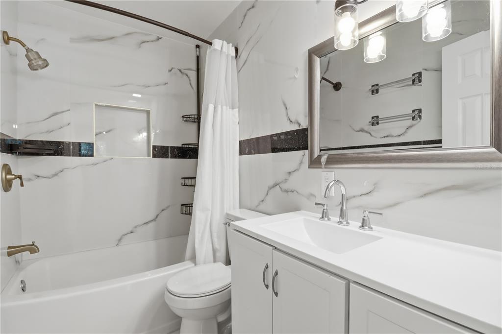 67 Cove Road Inglis, FL 34449 - Photo 17 of 35 a bathroom with a sink a toilet and a large mirror