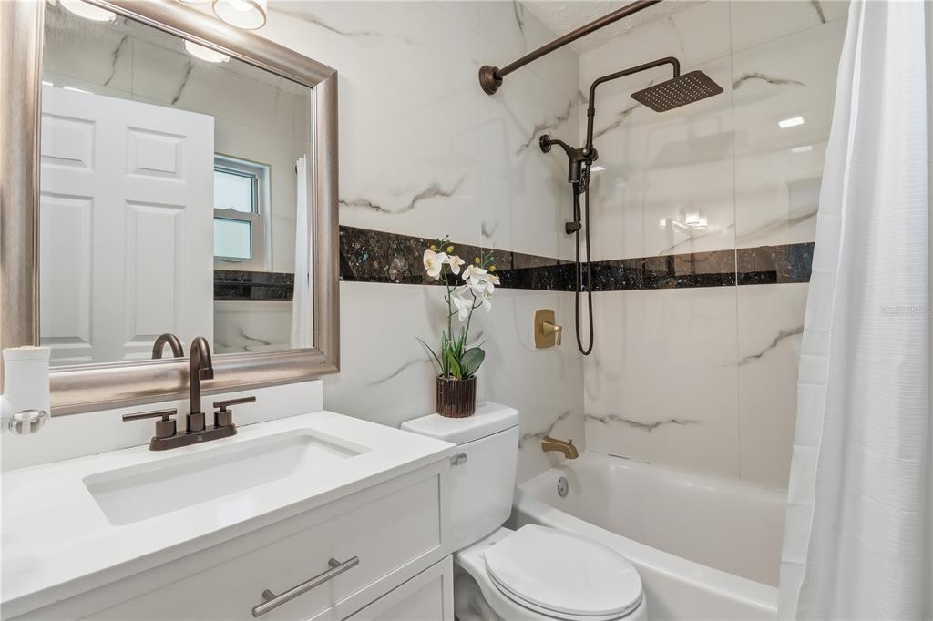 67 Cove Road Inglis, FL 34449 - Photo 24 of 35 a bathroom with a sink a toilet and shower