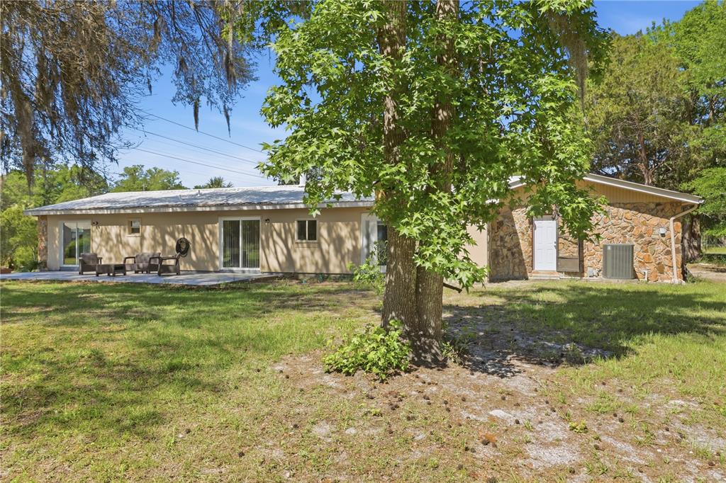 67 Cove Road Inglis, FL 34449 - Photo 33 of 35 a view of a house with a yard