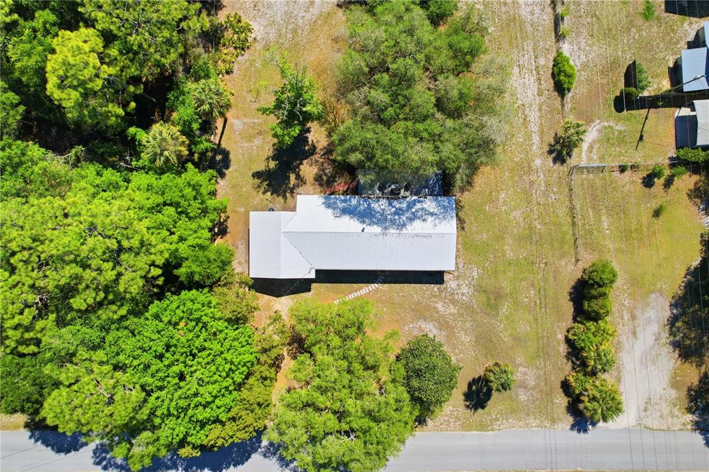 67 Cove Road Inglis, FL 34449 - Photo 35 of 35 an aerial view of residential house with outdoor space and trees all around