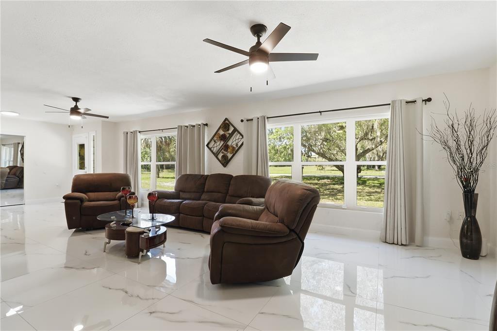 67 Cove Road Inglis, FL 34449 - Photo 7 of 35 a living room with furniture and a window