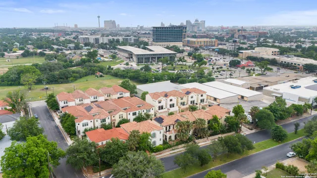an aerial view of residential houses with outdoor space