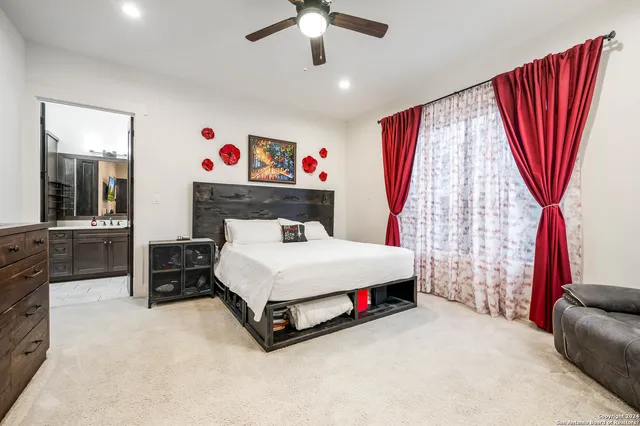 a bed room with a bed and a television