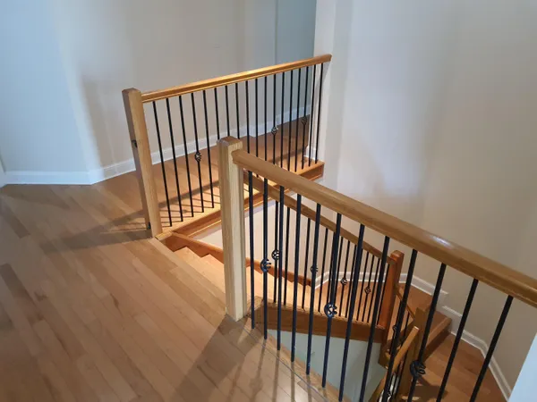 a view of a balcony with wooden floor