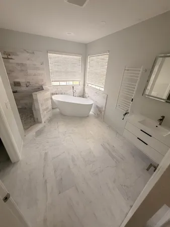 a bathroom with a sink toilet and tub