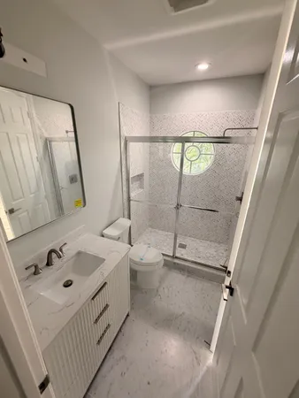 a view of a room with wooden floor and staircase