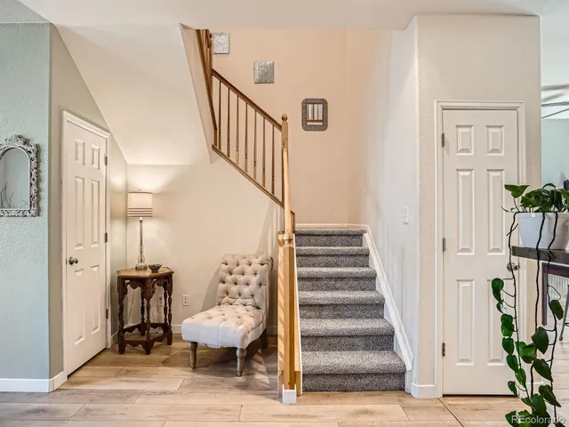 a view of entryway with wooden floor and stairs