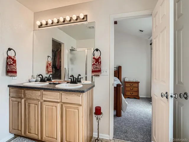 a en suite bathroom with a sink and mirror
