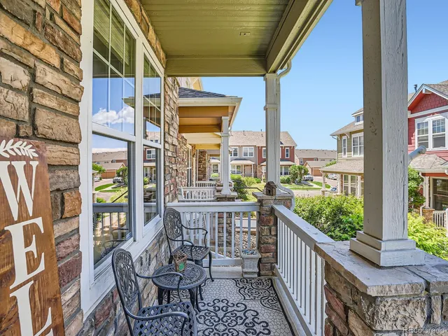 a view of a balcony with chairs