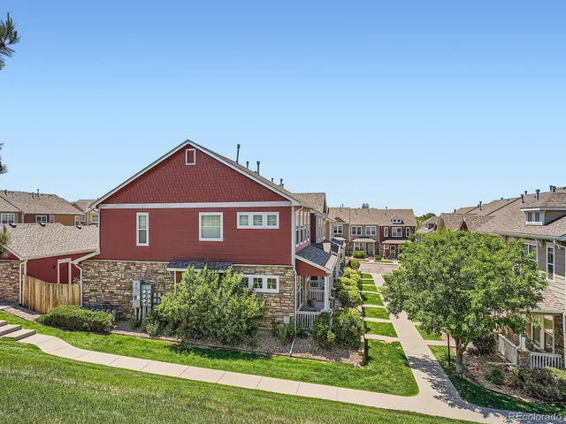 a view of a brick house with a yard