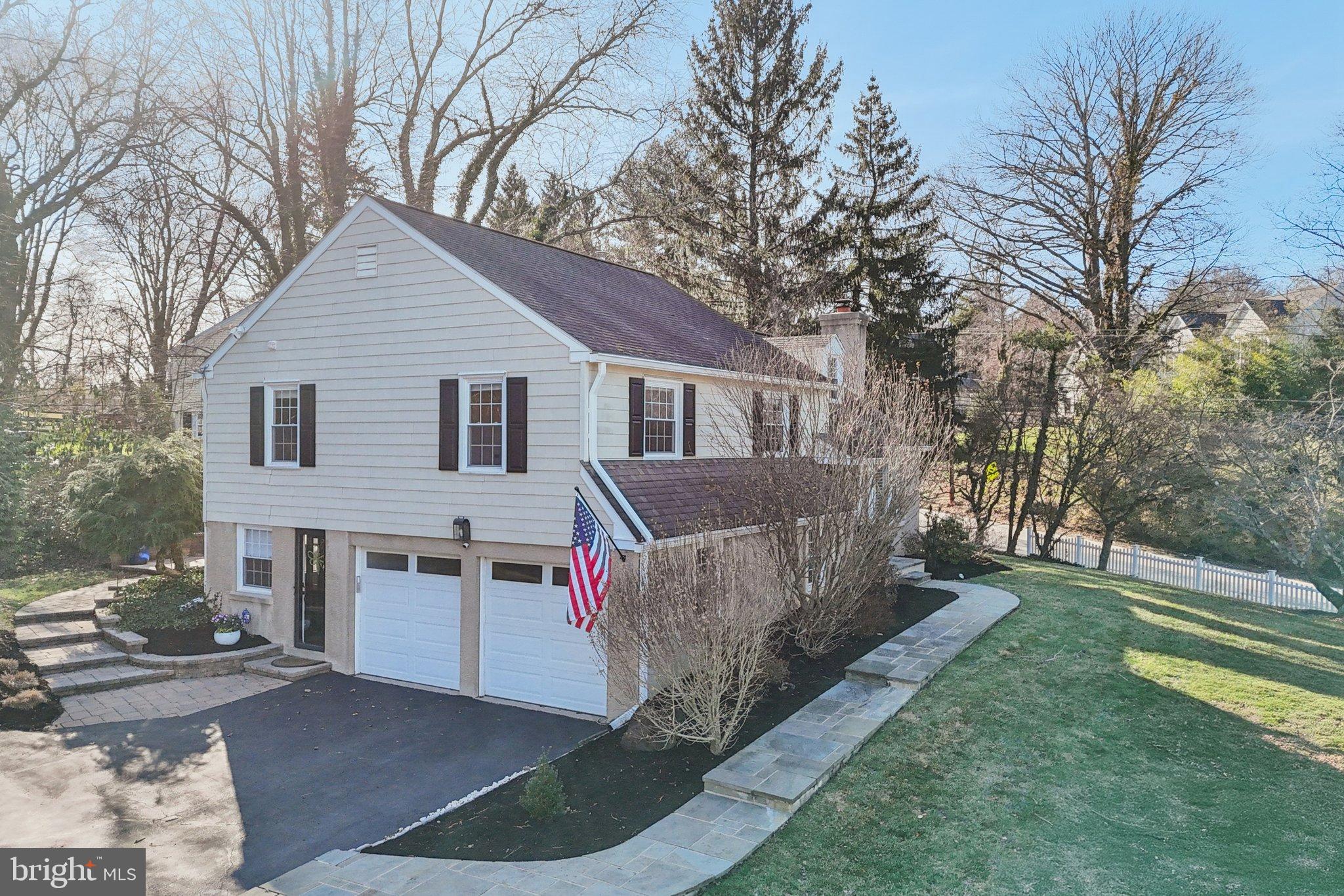 284 Croton Road Wayne, PA 19087 - Photo 3 of 48 Charming home with lush greenery and flag.