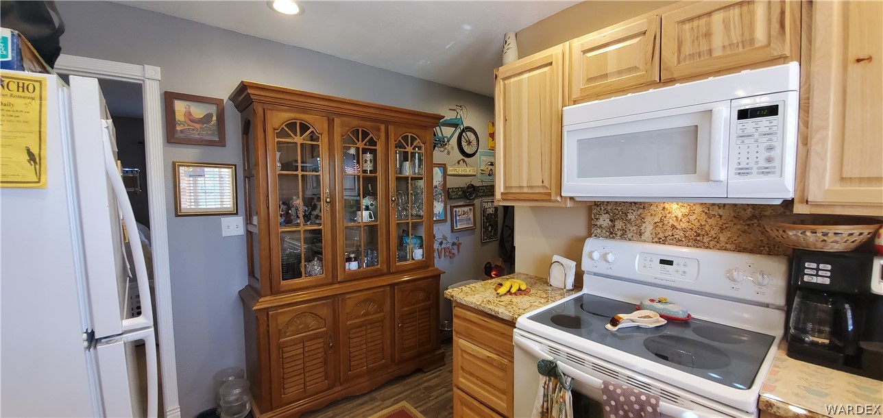 564 Bacobi Road Golden Valley, AZ 86413 - Photo 14 of 50 a kitchen with stainless steel appliances granite countertop a stove and a refrigerator
