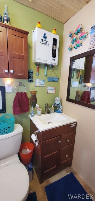 564 Bacobi Road Golden Valley, AZ 86413 - Photo 19 of 50 a bathroom with a toilet sink vanity and mirror