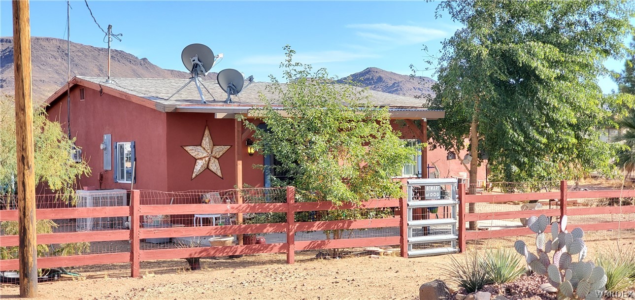 564 Bacobi Road Golden Valley, AZ 86413 - Photo 48 of 50 a front view of a building with street view