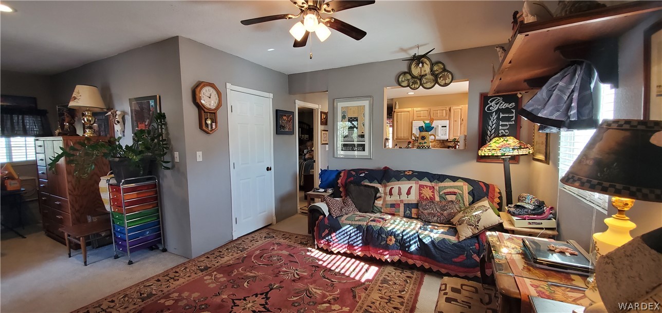 564 Bacobi Road Golden Valley, AZ 86413 - Photo 8 of 50 a bedroom with furniture and a potted plant