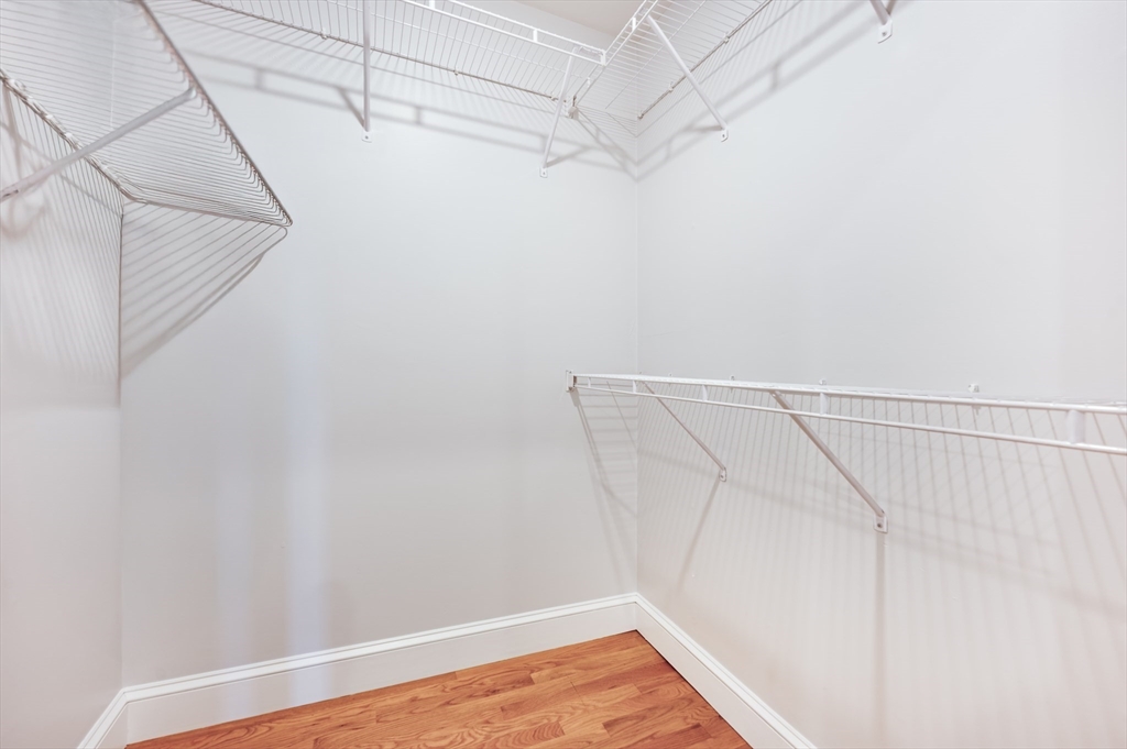504 East 8th Street, Unit 2 Boston, MA 02127 - Photo 9 of 13 a view of a room with racks on the wall