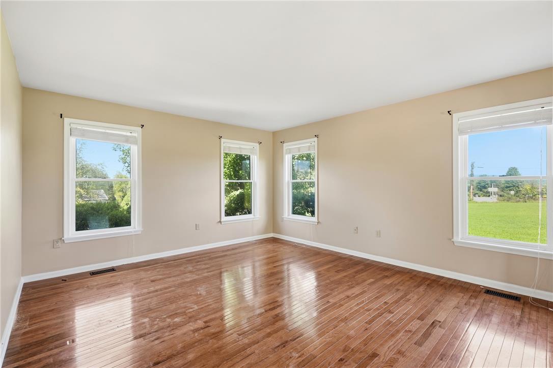 590 Fehr Road Nazareth, PA 18064 - Photo 6 of 79 Polished hardwood floors and multiple windows define this versatile living space.