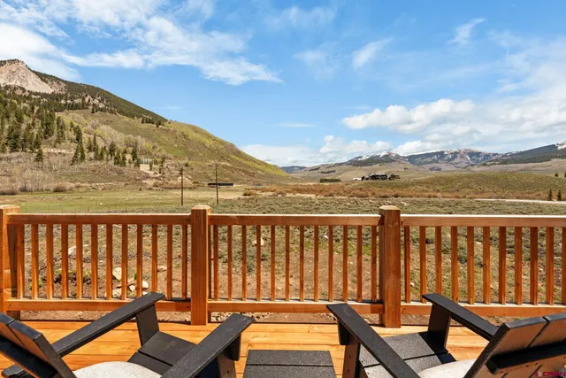 a view of a chairs on the roof deck