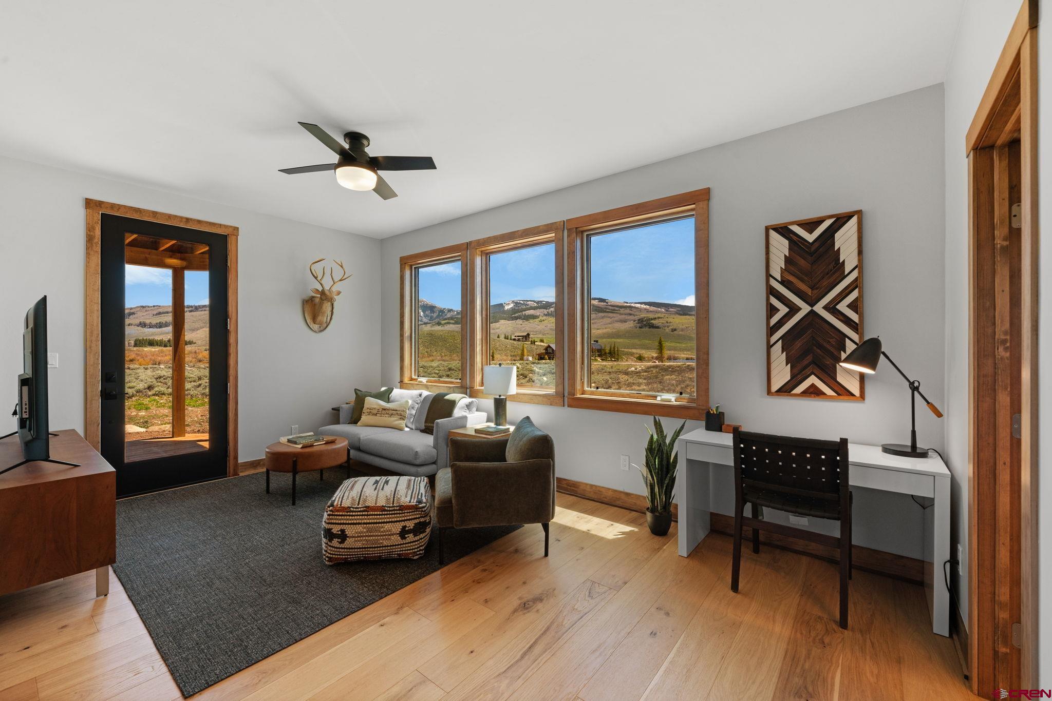 64 Buckhorn Way Crested Butte, CO 81224 - Photo 38 of 45 a living room with furniture and a large window