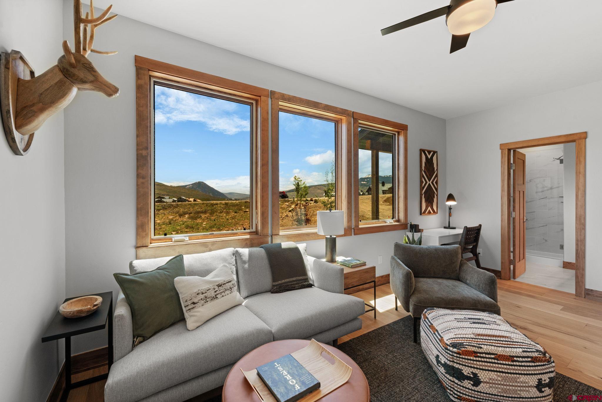 64 Buckhorn Way Crested Butte, CO 81224 - Photo 39 of 45 a living room with furniture and a large window
