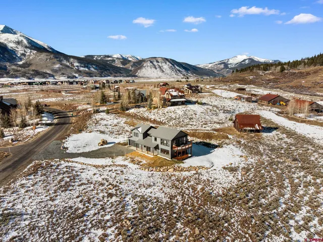 a view of ocean with a mountain