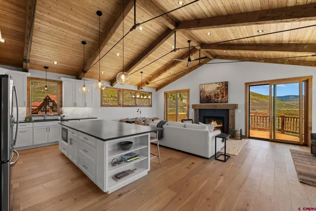 a kitchen with stainless steel appliances granite countertop a stove and a refrigerator