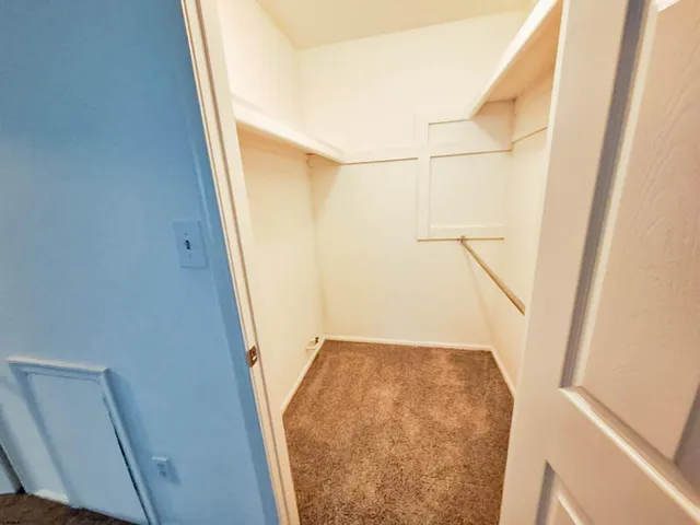 a view of staircase with white door