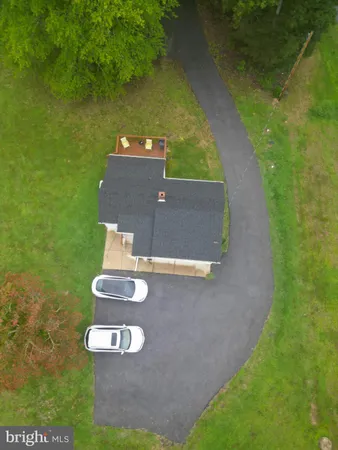 a view of a golf course with a house
