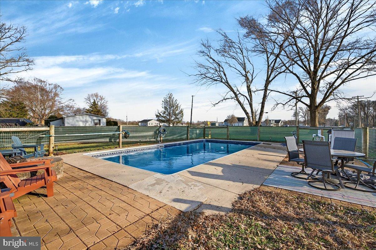 2505 West Denneys Road Dover, DE 19904 - Photo 53 of 68 Serene backyard oasis with inviting pool.