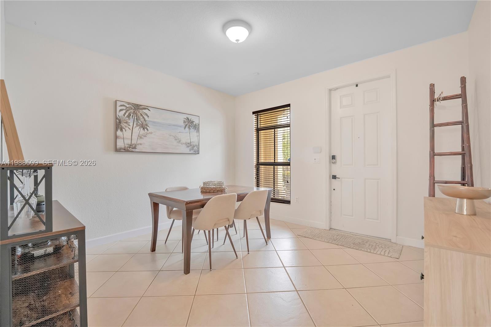 23484 Southwest 112th Court Homestead, FL 33032 - Photo 11 of 33 a view of a dining room with furniture and window