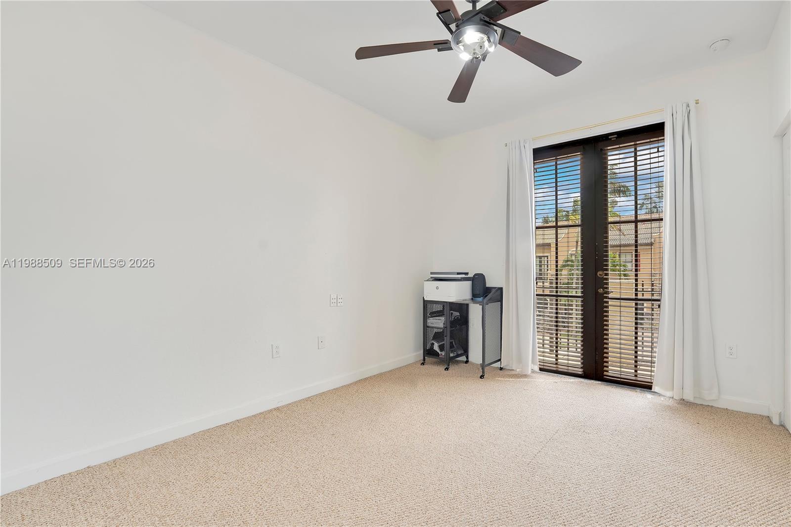 23484 Southwest 112th Court Homestead, FL 33032 - Photo 13 of 33 a view of a livingroom with a ceiling fan and window
