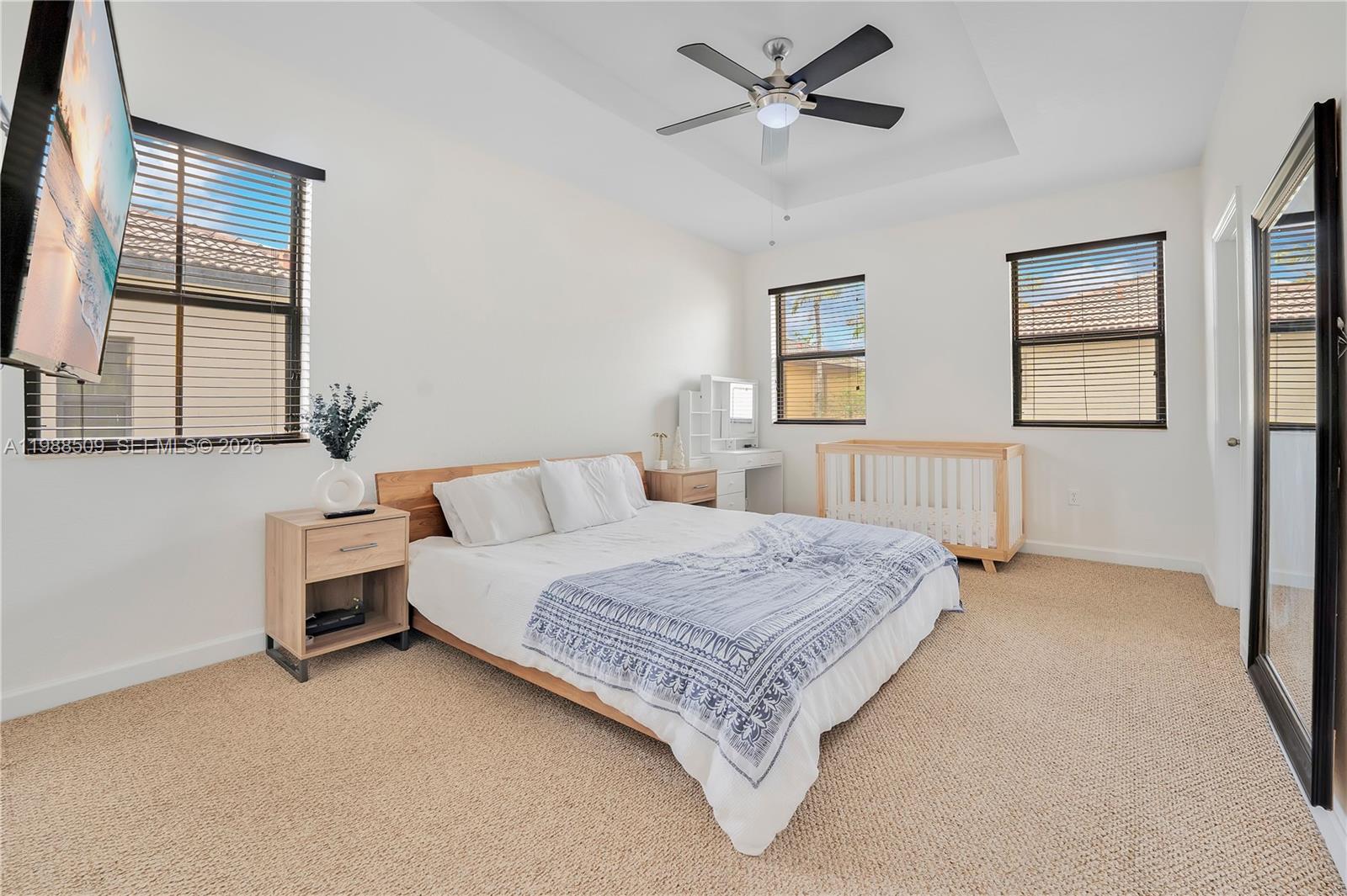 23484 Southwest 112th Court Homestead, FL 33032 - Photo 15 of 33 a bedroom with a large bed and window