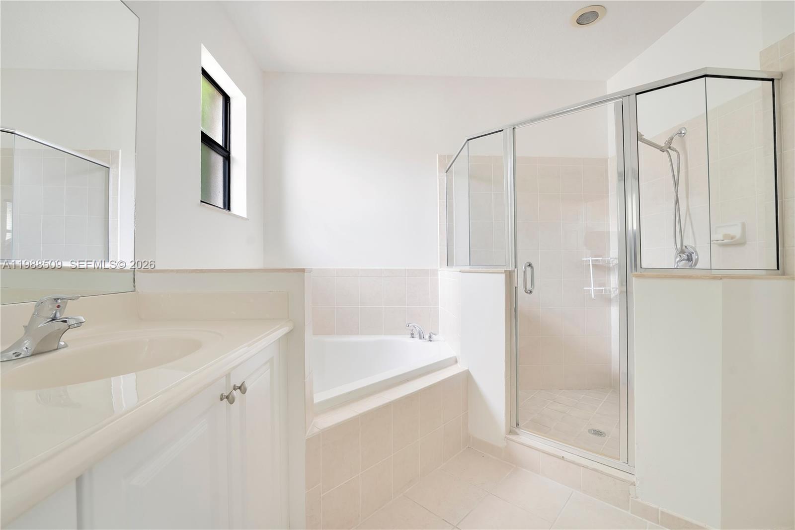 23484 Southwest 112th Court Homestead, FL 33032 - Photo 17 of 33 a bathroom with a bathtub and a sink