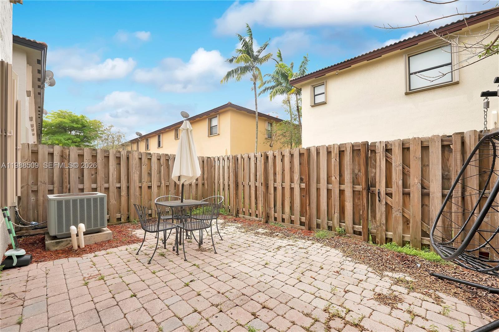 23484 Southwest 112th Court Homestead, FL 33032 - Photo 21 of 33 a chairs and a table in the patio