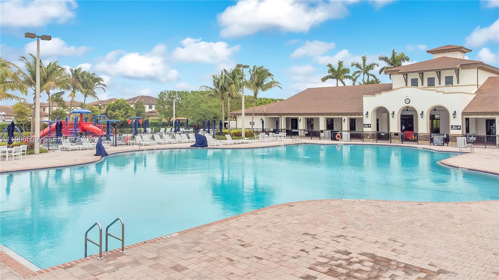 23484 Southwest 112th Court Homestead, FL 33032 - Photo 28 of 33 a view of a lake with a house in the background