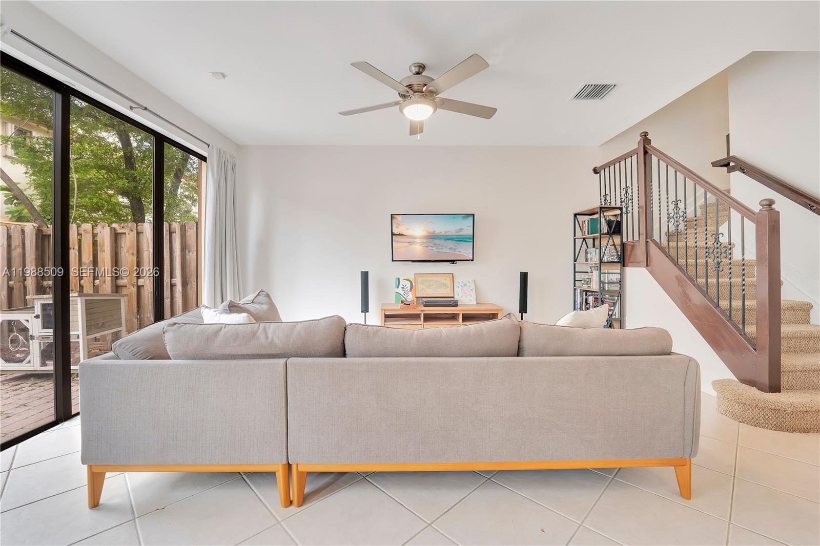 23484 Southwest 112th Court Homestead, FL 33032 - Photo 3 of 33 a living room with furniture and a large window