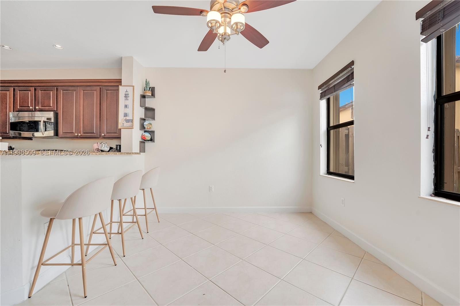 23484 Southwest 112th Court Homestead, FL 33032 - Photo 5 of 33 a kitchen with stainless steel appliances a refrigerator and microwave