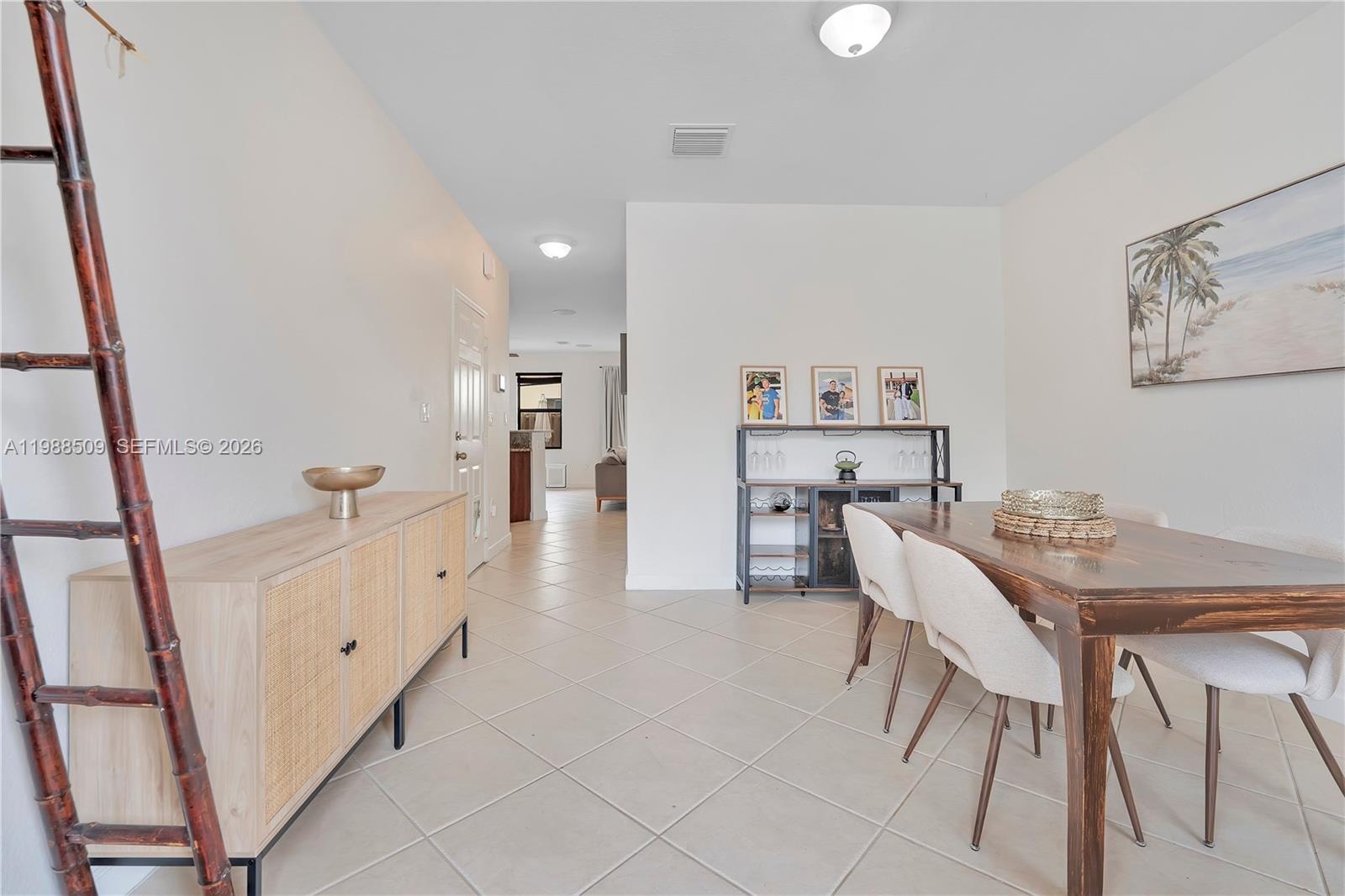 23484 Southwest 112th Court Homestead, FL 33032 - Photo 10 of 33 a view of a dining room with furniture