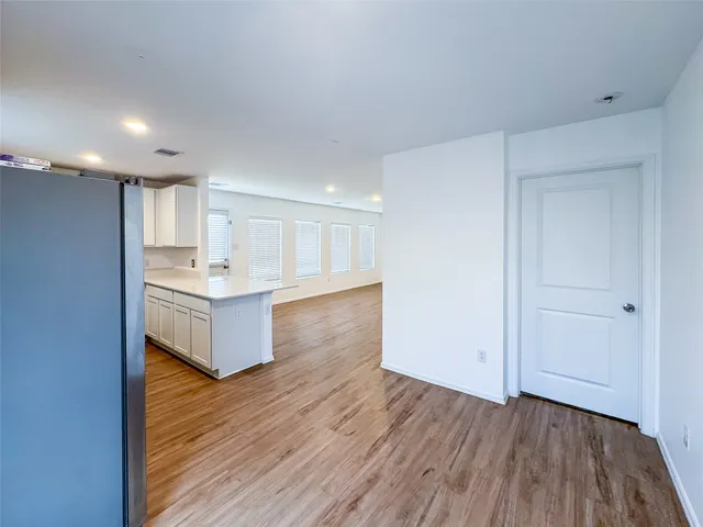 a view of kitchen with wooden floor