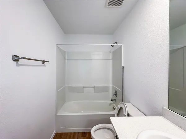 a bathroom with a bath tub and a shower