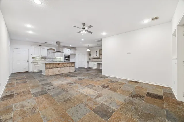 a kitchen with a stove and a sink