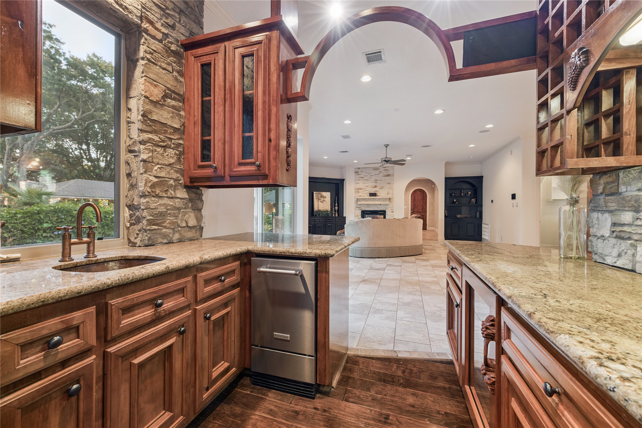 16218 Barklea Road Cypress, TX 77429 - Photo 19 of 36 a kitchen with stainless steel appliances granite countertop a sink and wooden cabinets