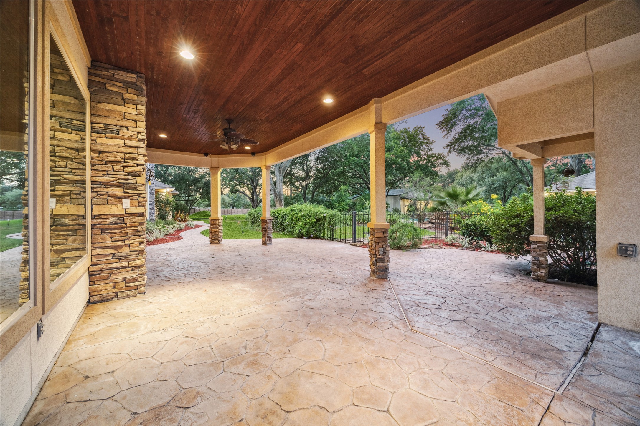 16218 Barklea Road Cypress, TX 77429 - Photo 33 of 36 a view of a patio with table and chairs next to a yard
