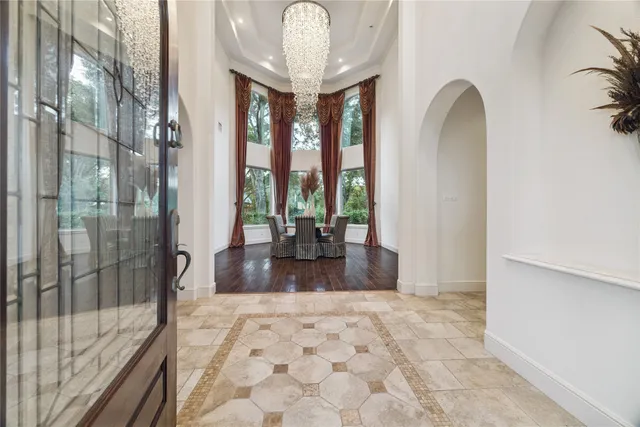 a view of entryway and hall with a dining space
