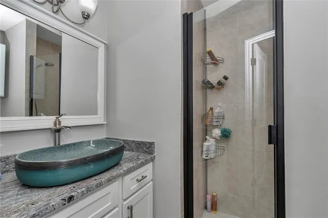 a bathroom with a mirror and a sink