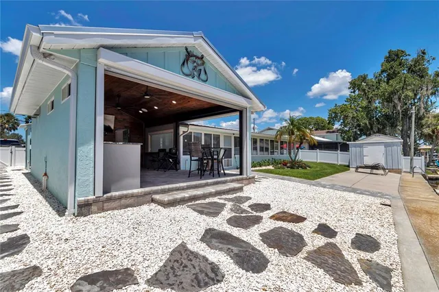 a view of a balcony with dining table and chairs with wooden floor