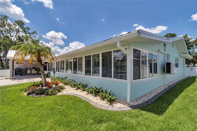 a bed room with a bed and a potted plant