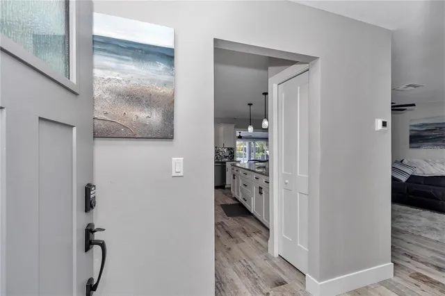 a view of a kitchen from the hallway